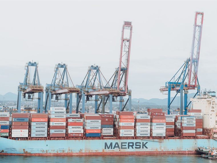 Container ship and cranes at an industrial port